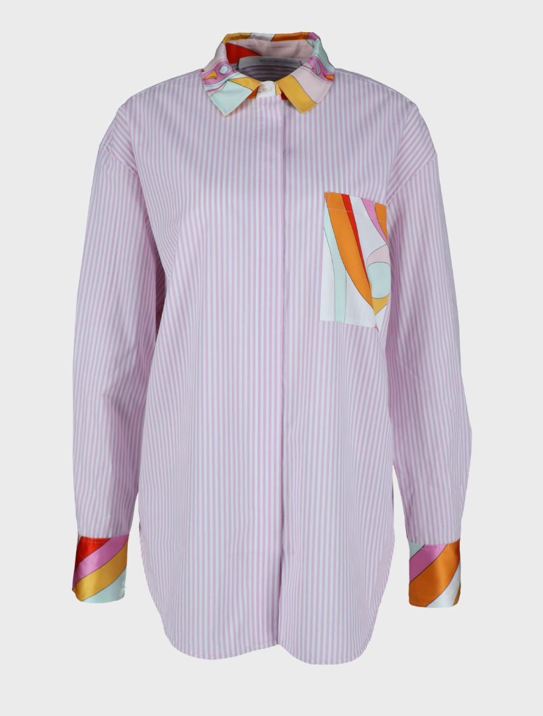 A "Gigi Multi" blouse adorned with an array of bright, colorful patterns, perfect for a stylish look.