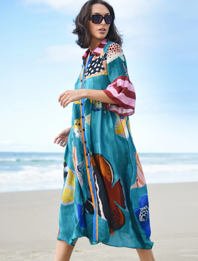 Eye-catching dress with a multi-fish motif, perfect for casual summer wear or beach-themed occasions.