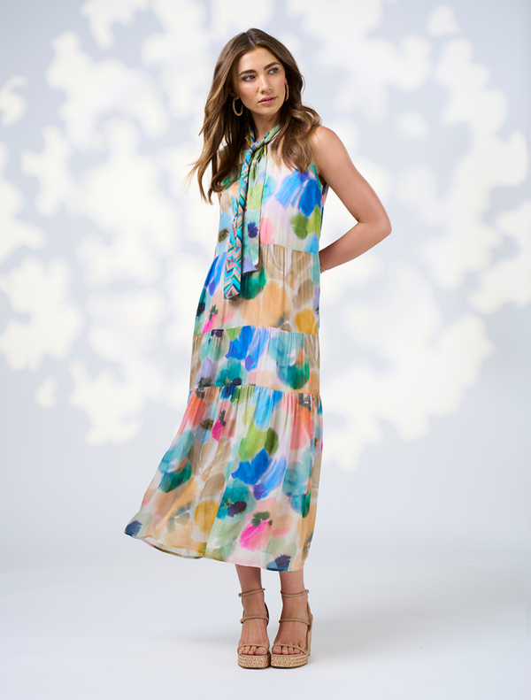 Vibrant multi-patterned midi dress with a tie waist, showcasing a relaxed fit and playful style.