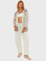 Mykonos cardigan featuring colorful floral designs and geometric patterns, complemented by motivational text and cheerful smiley faces.