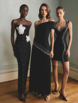 Sophisticated black gown with off-shoulder design, intricate pearl details, and a flowing skirt, perfect for evening events.