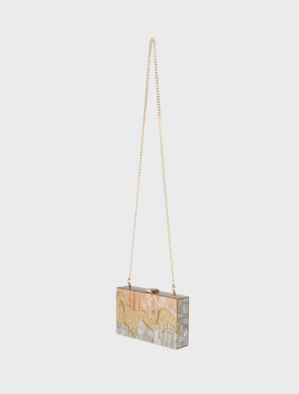 Elegant gold and white handbag with a chain strap, perfect for adding a touch of sophistication.
