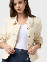 Buttermilk linen blend jacket with frayed edges, panel seams, and full lining for a tailored fit and stylish detail.