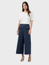 Indigo linen blend Navi Pants feature forward side seams, elastic back waist, and frayed edging for a relaxed, stylish look.