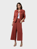 Sandalwood Navi Pants featuring a linen blend, elastic back waist, and frayed edges for a relaxed, stylish look.