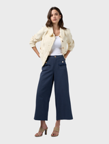 Buttermilk linen blend jacket showcasing frayed edges, detailed trim, and panel seams, fully lined for enhanced comfort.