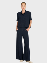 Stylish navy and chalk striped suit pants featuring a clean finish waistband, elastic back, and convenient front pockets.