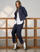 Navy highlight jacket with a modern cut, ideal for layering in cooler weather.