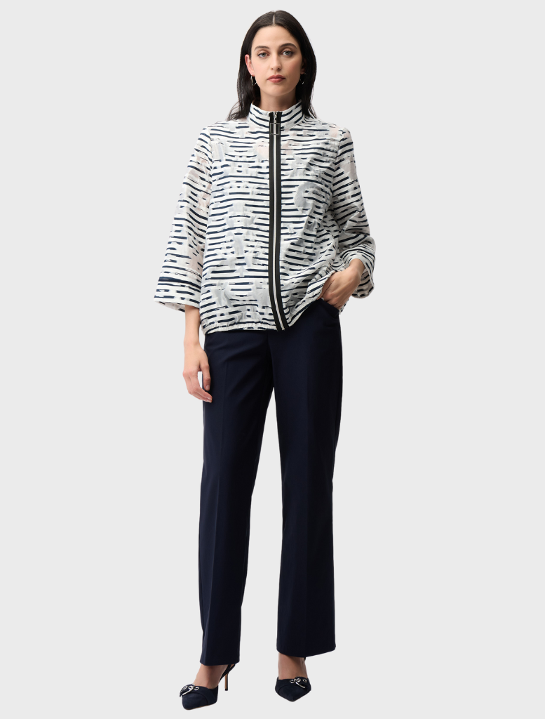 Off-white and navy jacket on display, highlighting a sleek design perfect for layering in various weather conditions.