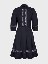 Elegant navy short dress by Olivia, designed with a flattering silhouette and versatile for various events.
