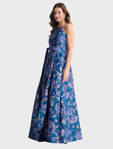 A navy and pink Clara dress hanging on a rack, highlighting its stylish pattern and fabric texture.