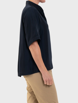 Elegant navy Placket Plaza Top with a buttoned placket, perfect for versatile styling options.