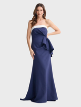 Jefferson dress in navy and white stripes, elegantly draped on a hanger, emphasizing its stylish design.
