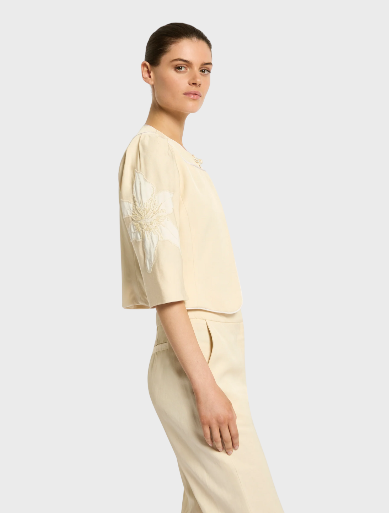 Stylish Nikita Jacket in straw, perfect for layering and enhancing both casual and dressy looks.