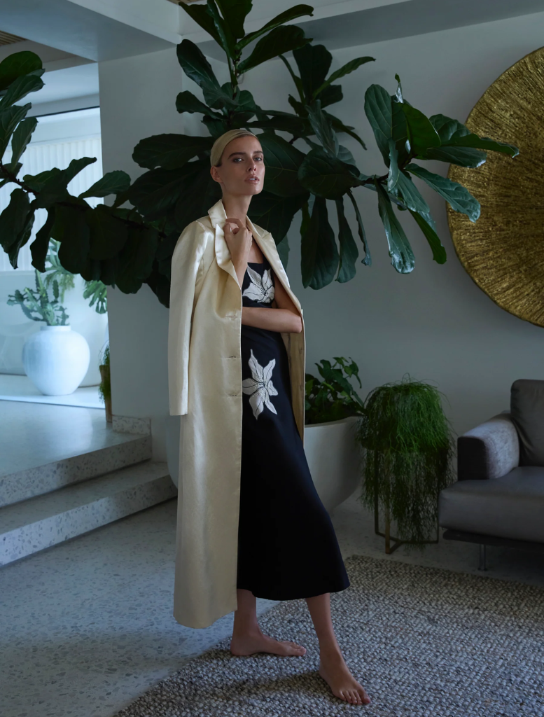 Nikita Midi dress in black, featuring a sleek design and elegant silhouette suitable for various occasions.