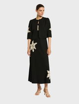 Elegant black Nikita Midi dress with a flattering fit, ideal for dressing up or down for any occasion.