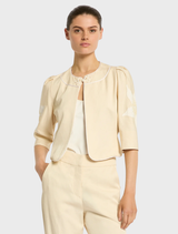 Nikita Jacket, straw-colored, showcasing a modern silhouette ideal for both everyday wear and special events.