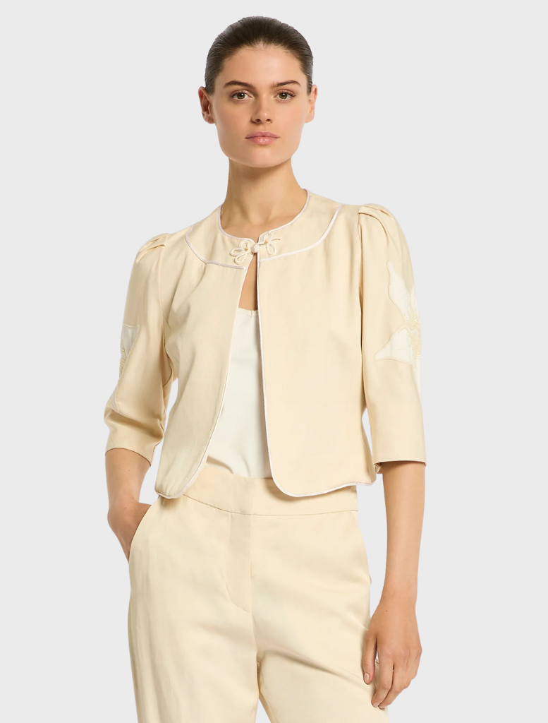Nikita Jacket, straw-colored, showcasing a modern silhouette ideal for both everyday wear and special events.