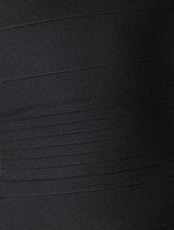 Floor-length black column dress with a square neckline, combining elegance and modern style for any occasion.