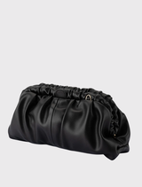 Modern black clutch with gathered detailing, internal zipper pocket, and removable chain for hands-free convenience.
