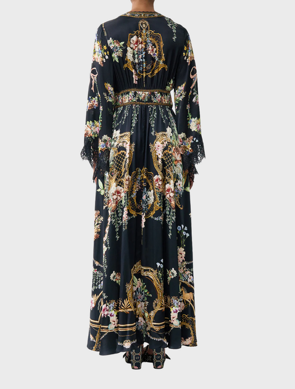 Elegant kimono-sleeve dress with intricate shirring detail, perfect for a sophisticated look.