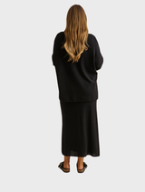 Elegant Winter Retreat Merino Cotton Skirt in Noir, perfect for layering in chilly weather.