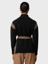 Elegant high neck sweater in black chevron pattern, made from a soft wool-viscose blend for warmth and comfort.