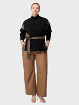Black chevron-patterned high neck sweater made from a wool-viscose blend, showcasing a stylish and cozy design.