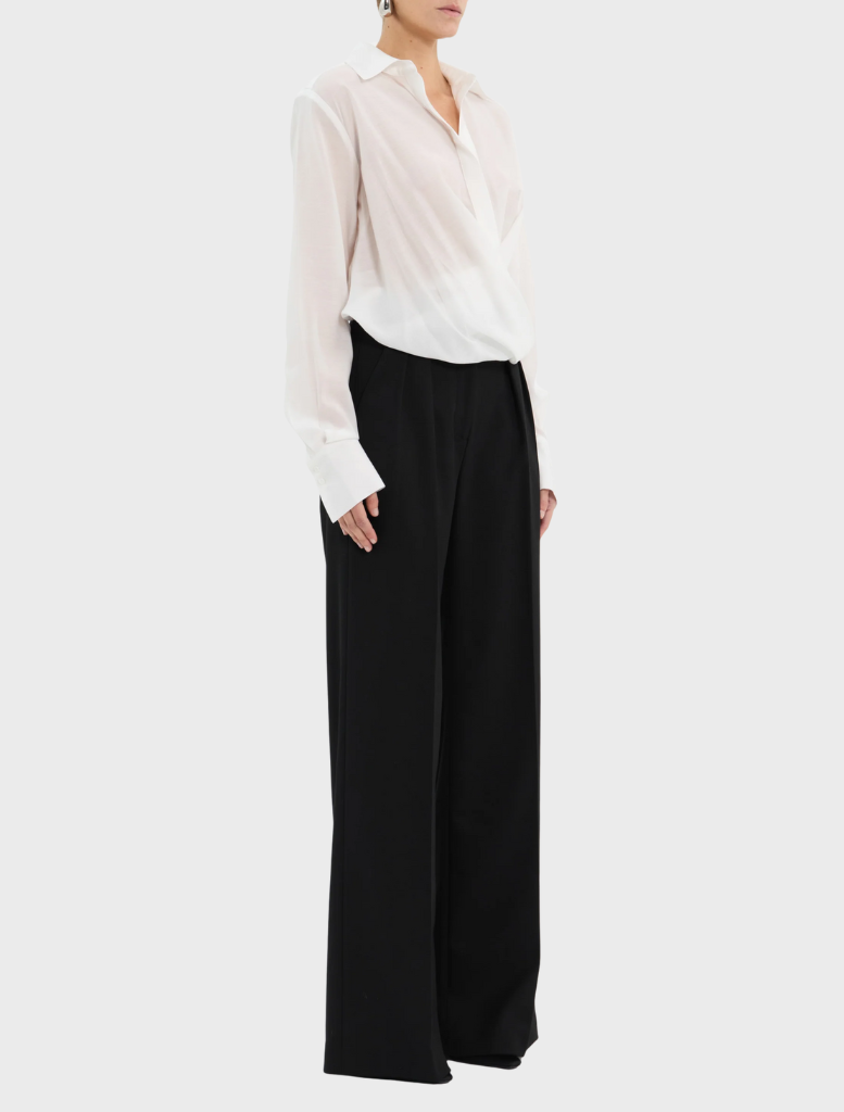 A long-sleeve white shirt is displayed in an open position, emphasizing its lightweight fabric.