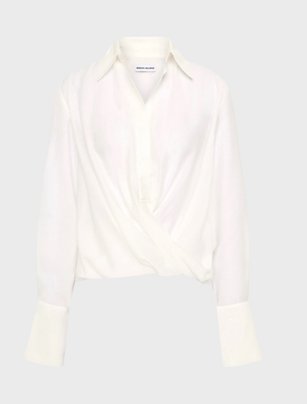 A white long-sleeve shirt is open, showcasing its relaxed fit and simple design.