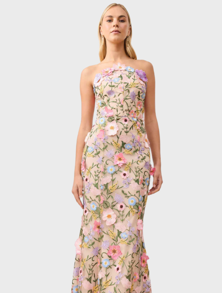 Chic strapless gown made from a lively floral print fabric, ideal for special events or gatherings.
