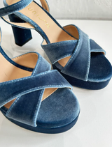 Odara velvet jeans draped over a chair, illustrating their plush material and contemporary style.