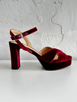 Velvet fabric in a rich bordo color, showcasing a luxurious texture and deep, warm hue.