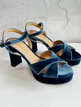 Odara velvet jeans hanging on a hanger, emphasizing their luxurious texture and elegant fit.