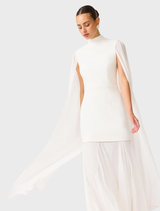 Elegant white gown with cape sleeves, showcasing a sophisticated design suitable for formal occasions.