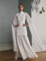 White gown featuring stylish cape sleeves, perfect for evening events and formal gatherings.