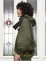Off-duty jacket in khaki color, presented flat, showcasing its relaxed fit and practical design for casual occasions.