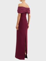 Sophisticated off-the-shoulder gown in deep wine, highlighting a tailored bodice and a beautifully flowing skirt.