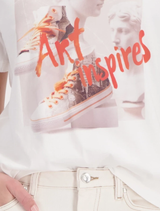 Stylish Off-White T-shirt alongside chic sneakers, illustrating a blend of comfort and urban fashion.