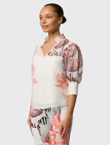 Lightweight Oleander Blouse in Nautilus Bloom, showcasing a shirred collar, gathered sleeves, and a detachable slip.