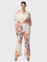 Nautilus Bloom Oleander Blouse, crafted from cotton-silk, features a flattering V-neck and three-quarter puff sleeves.