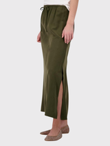 Soft olive modal maxi skirt with an elastic waist, side slit, and simple design, ideal for casual or elevated occasions.