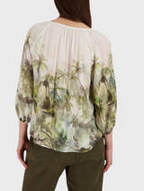 Elegant olive tropical blouse with ¾ sleeves and round neckline, made from 100% viscose, suitable for summer fashion.