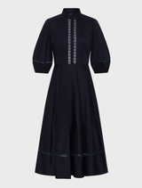 Elegant Olivia dress in deep ink color, featuring a fitted silhouette and flowing skirt, perfect for formal occasions.
