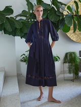 Olivia dress in rich ink hue, showcasing a tailored fit and graceful draping, ideal for evening events.
