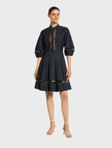 Navy Olivia short dress with a stylish cut, ideal for summer outings or evening gatherings.