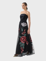 Black rose design on the Olympia skirt, presented hanging to emphasize its style and fabric.