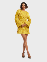 Elegant mini dress with opulent embellishments and stylish bell sleeves, perfect for special occasions.