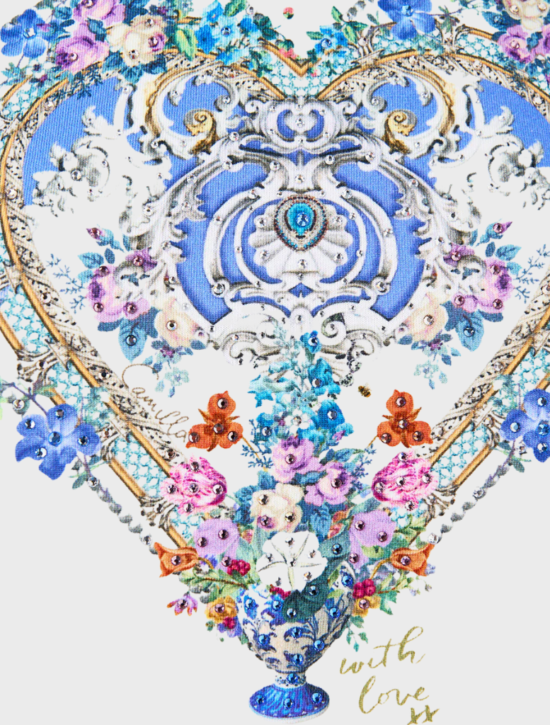 Blue and white skirt made of patterned fabric, complemented by a Double Frill Sleeve Tee from Ottoopp.