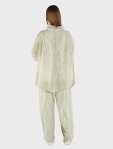 Lime print oversized nylon jacket featured prominently, highlighting its bold color and style.